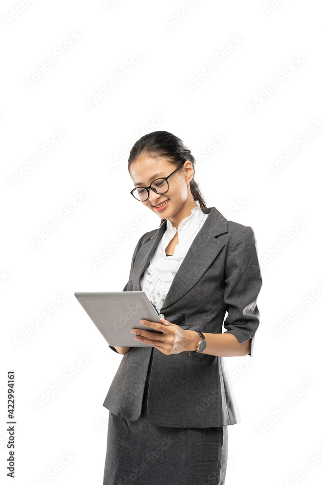 Young pretty business woman holding tablet wearing suit on white background Young pretty business woman holding tablet wearing suit on white background