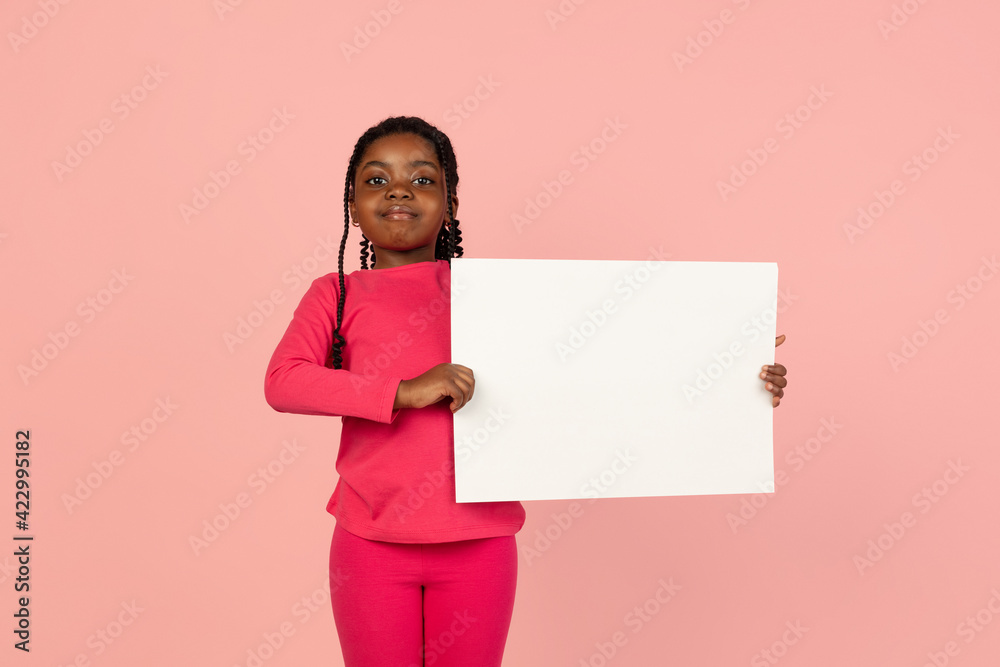 Handsome african little girl portrait isolated on pink studio background with copyspace Handsome african little girl portrait isolated on pink studio background with copyspace