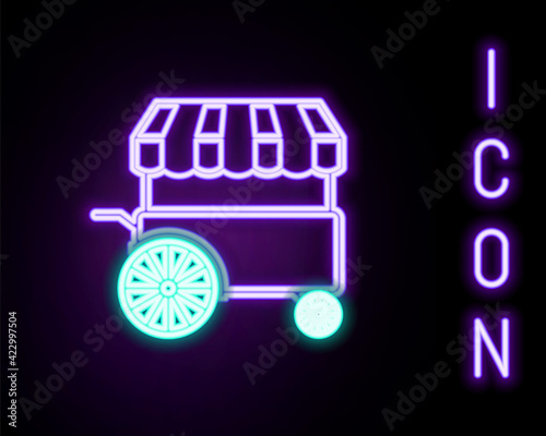 Glowing neon line Fast street food cart with awning icon isolated on black background. Urban kiosk. Colorful outline concept. Vector