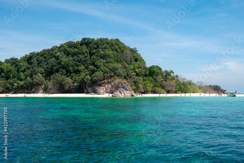 Khai island or Koh Khai, Satun province Thailand, place stop by on the way to Lipe island, small fresh green mountain and white sand beach island, clear blue sea © Thitiporn