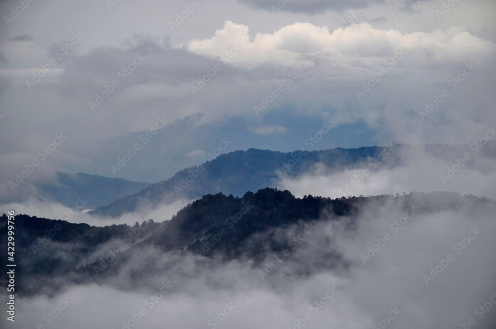 Panoramic view of ridges with cloud, silvery mist