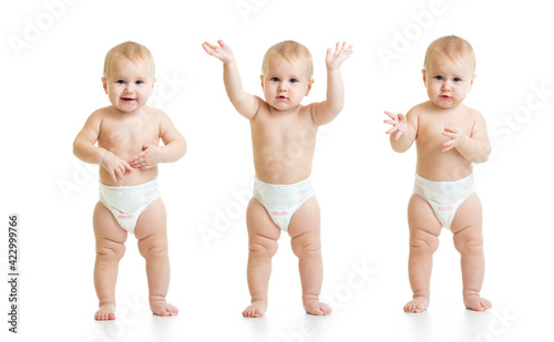 Photographie Three poses of standing baby isolated on white background