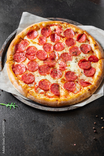 pizza cheese, sausage, tomato sauce meal top view copy space food background rustic