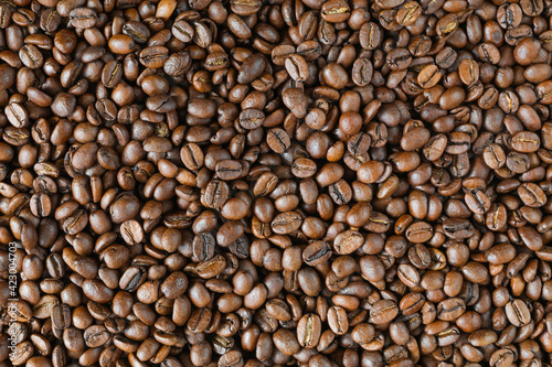 Detailed background of roasted coffee beans - top view