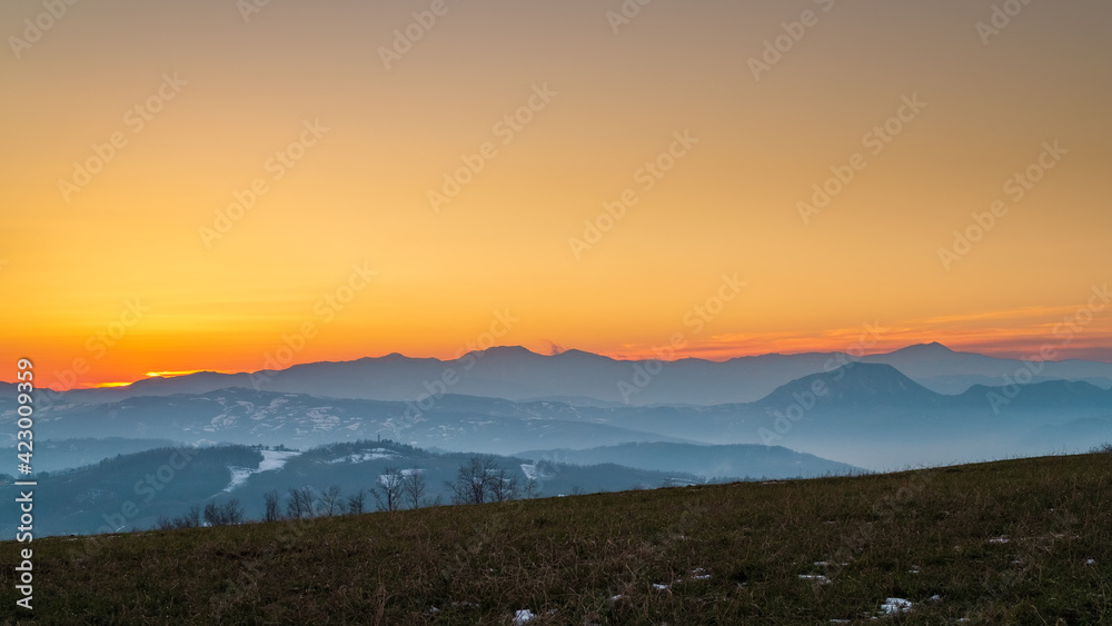 Sunset on the Appenine mountain ridge in Emilia and Romagna. Bologna province, Emilia-Romagna, Italy.