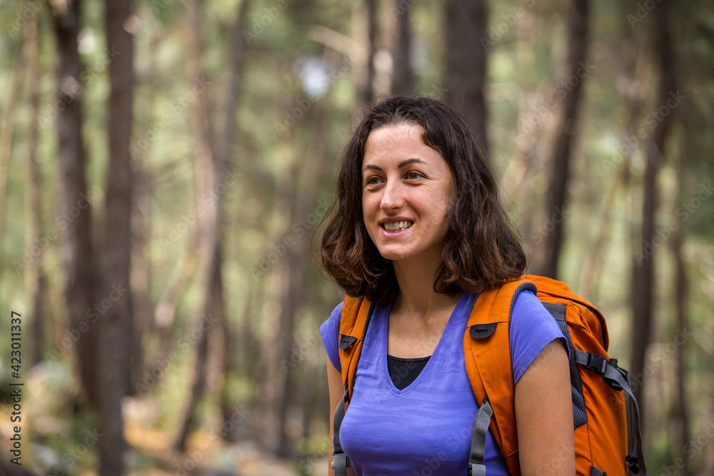 girl with a backpack on a hike girl with a backpack on a hike