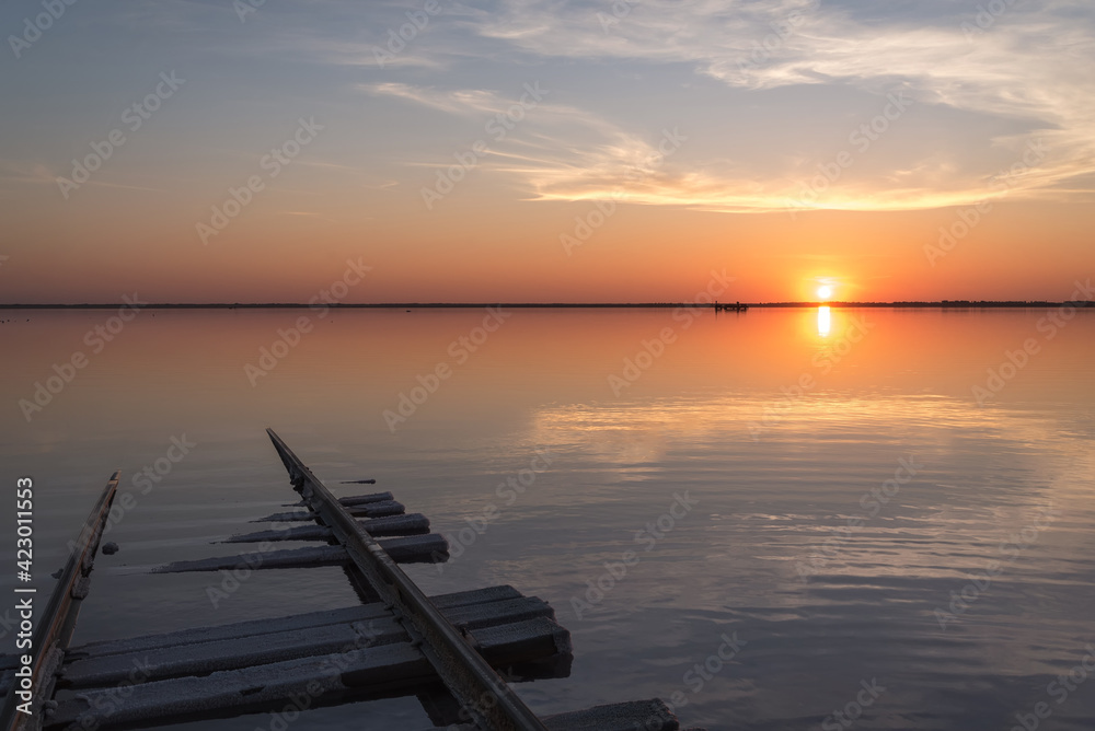 sunset lake clouds rails reflection salt horizon
