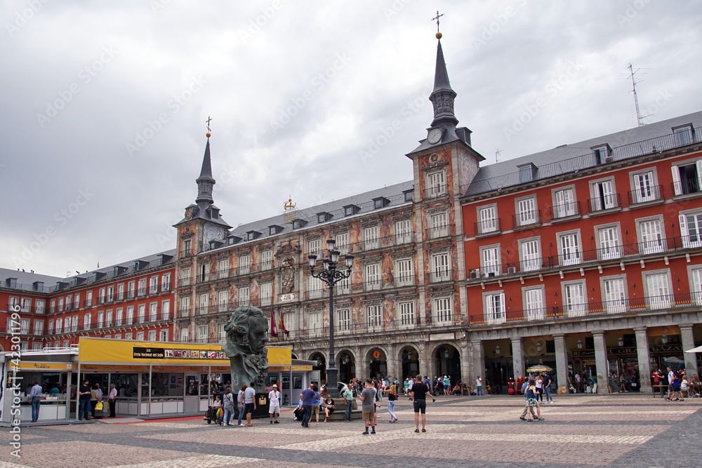 Tourists walking in Plaza Mayor, a major public space in the heart of Madrid, the capital of Spain renowned for its rich repositories of European art.