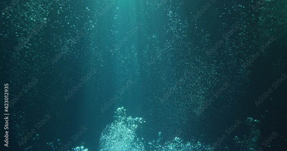 Sunbeams and bubbles underwater