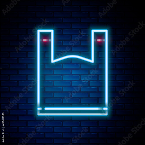 Glowing neon line Plastic bag icon isolated on brick wall background. Disposable cellophane and polythene package prohibition sign. Colorful outline concept. Vector