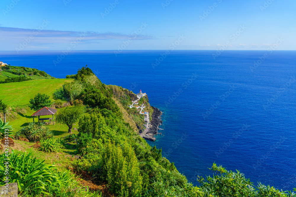 Landscape with the Lighthouse Ponta do Arnel near Nordeste town in Sao Miguel, Azores