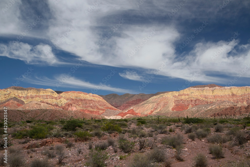 Fototapeta premium Hiking in the desert. Panorama view of the colorful rock and sandstone mountain in Humahuaca, Jujuy, Argentina.