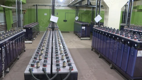 Rows of industrial storage batteries.A room used for backup or uninterruptible power supply. Power station.