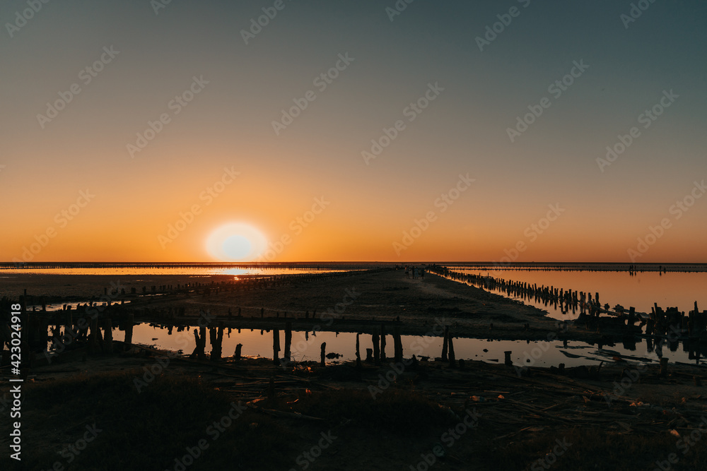 Dawn or sunset on the seashore. A place to relax in summer Dawn or sunset on the seashore. A place to relax in summer