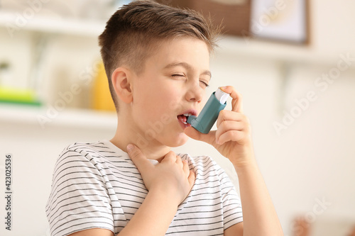 Little boy with inhaler hav...