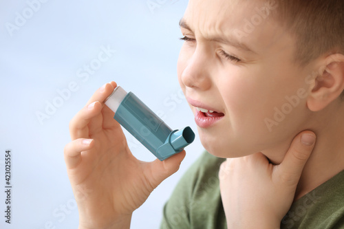 Little boy with inhaler hav...
