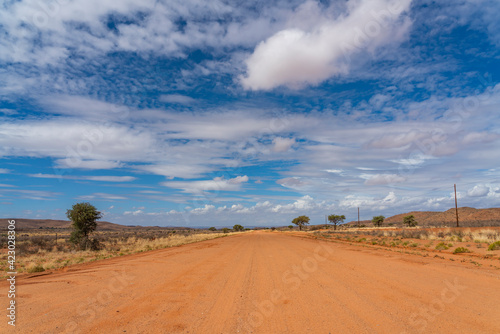 Namibian typical street with beautiful clouds at Namib Naukluft National Park