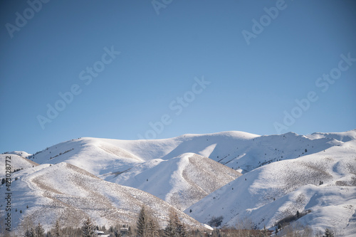 View of the Snowy Sawtooth Mountains on Sunny Day in Ketchum, ID photo