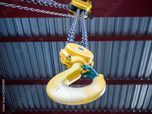 Hook of a hand loader under the ceiling of a building photo