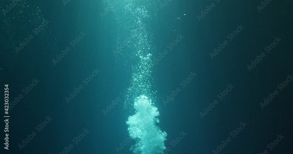 Sunbeams and bubbles underwater