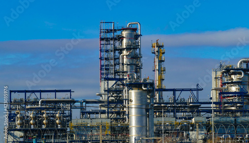 Corps of Moscow refinery in spring in clear weather