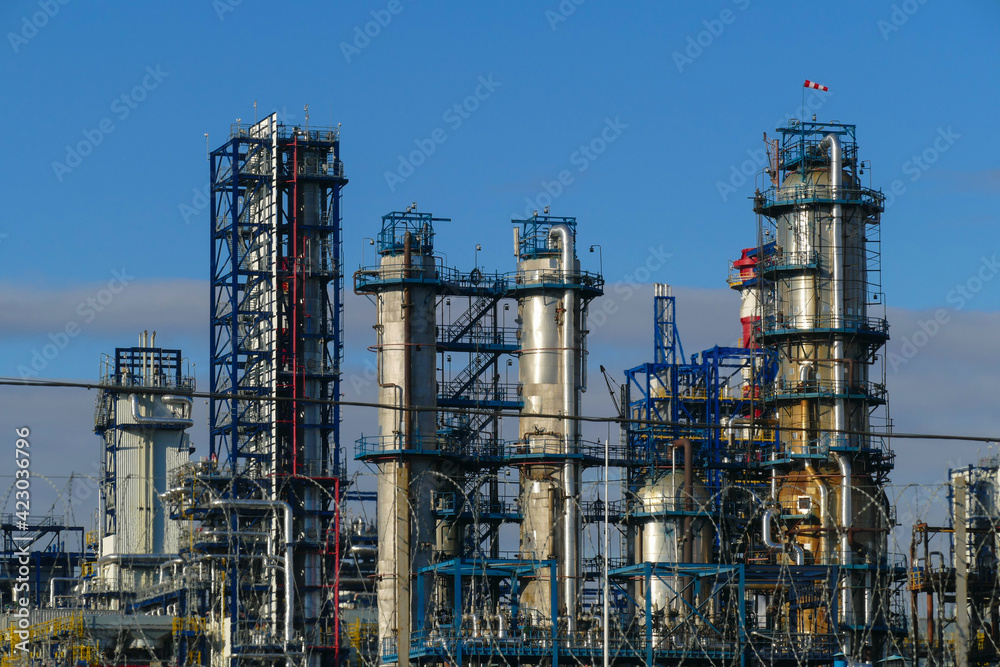 Corps of Moscow refinery in spring in clear weather