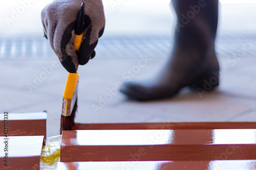 Closeup DIY project. Painting steel by hand. Home project painting steel.