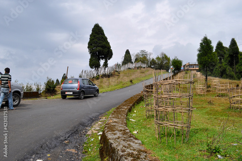 Car on hill top and prayer flag