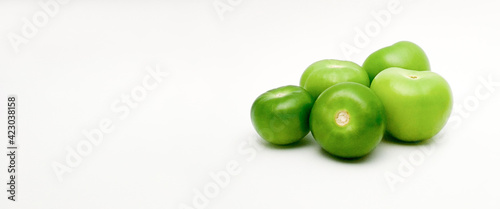 green tomatillos (Physalis philadelphica) with copy space on white background