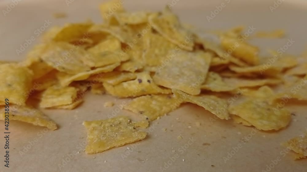 a zoom out of a bowl of nachos on the table a zoom out of a bowl of nachos on the table