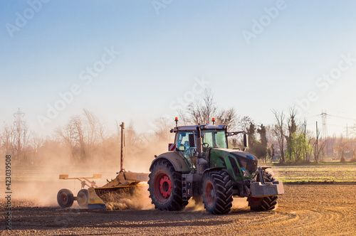 Tractor working in the field  preparing the land for planting