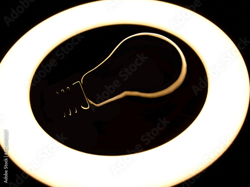 Incandescent lamp inside LED ring light source Concept photography, the light takes the form of an incandescent lamp