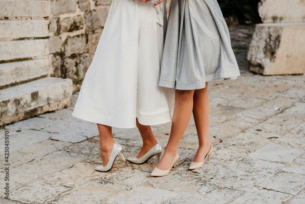 bride and maid of honor wedding day