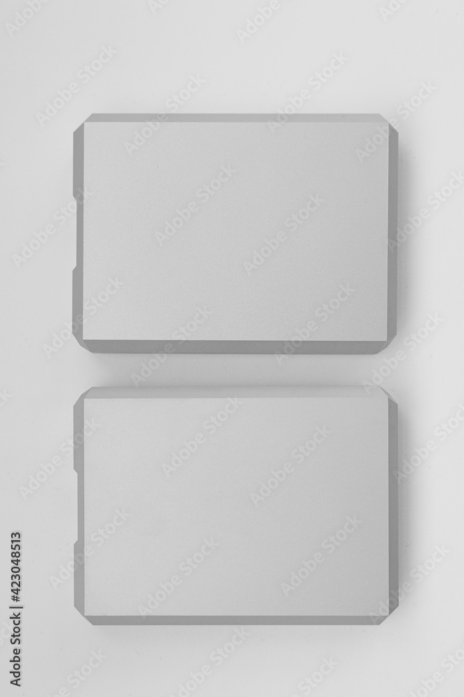 Two stylish aluminum external hard drives. Data backup and storage concept. Two stylish aluminum external hard drives. Data backup and storage concept.