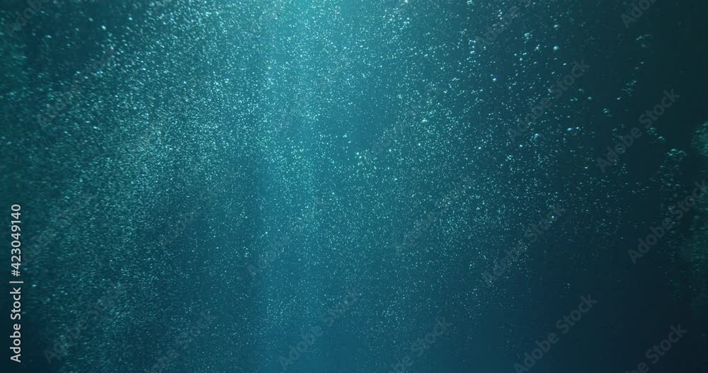 Sunbeams and bubbles underwater