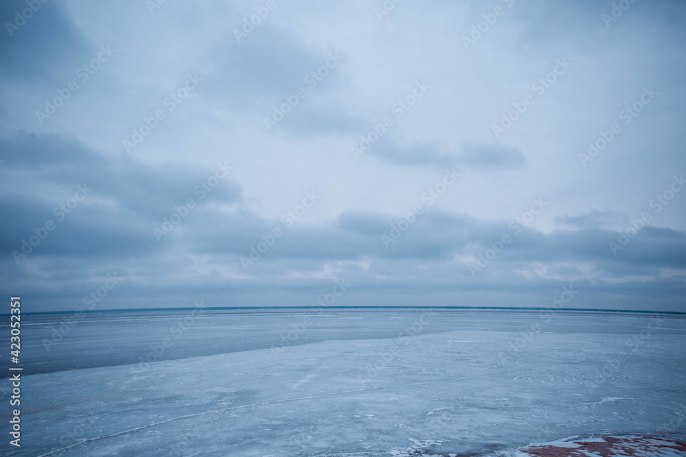 Fototapeta premium Empty snow land. Gray sky and ice 