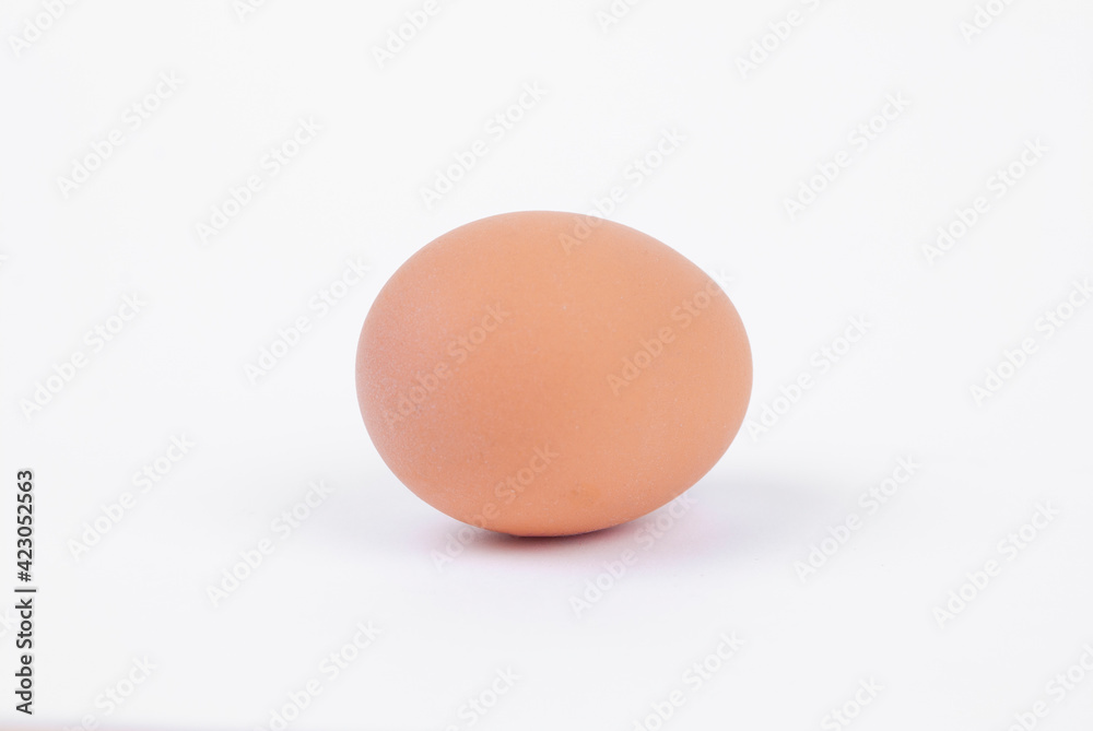 Egg on a white background. Yellow chicken egg Egg on a white background. Yellow chicken egg
