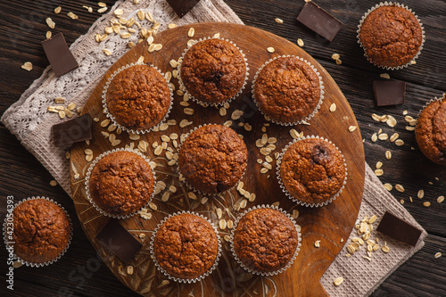 Homemade oat flakes muffins with peanut butter and chocolate.