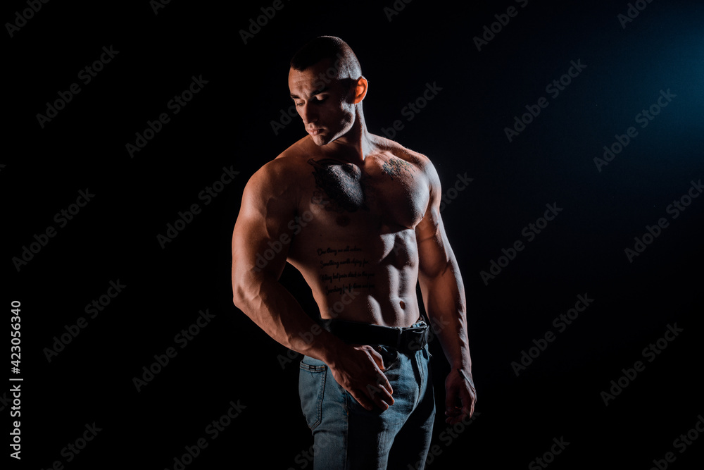 Powerful strong man with muscular bodybuilder