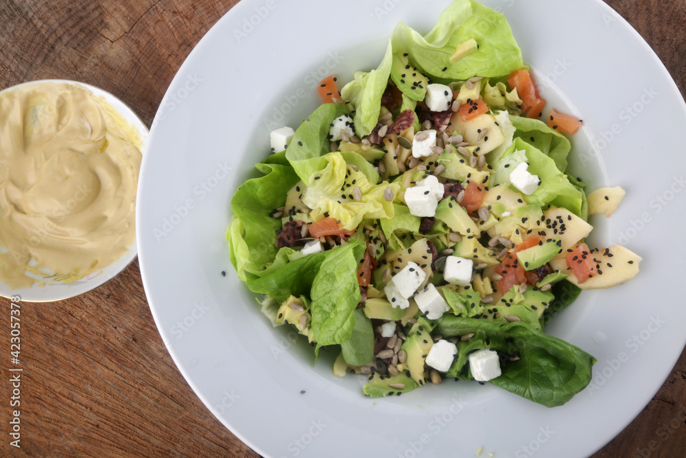 green salad with avocado and mozzarella