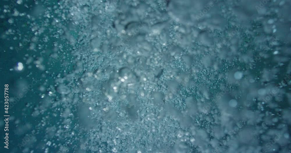 Blue water bubbles underwater
