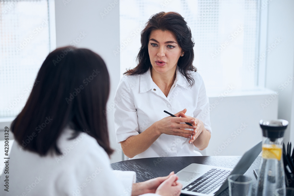 Woman getting a consultation from a doctor