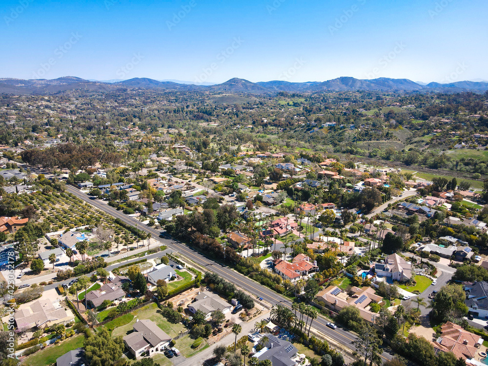 Fototapeta premium Aerial view of Rancho Santa Fe neighborhood with big mansions with pool in San Diego, California, USA. Aerial view of residential modern luxury house.