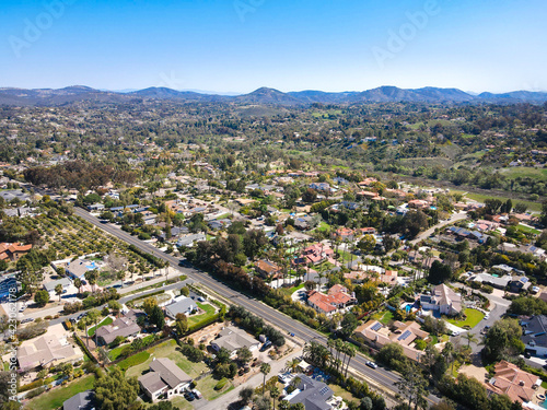 Aerial view of Rancho Santa Fe neighborhood with big mansions with pool in San Diego, California, USA. Aerial view of residential modern luxury house. © Unwind