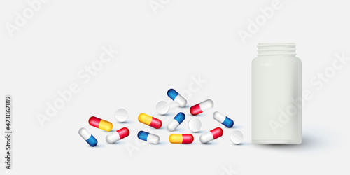 Bottle and scattered pills on color background.