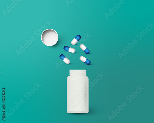 Bottle and scattered pills on color background.