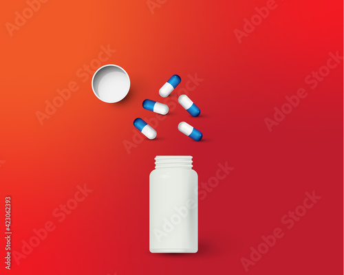 Bottle and scattered pills on color background.