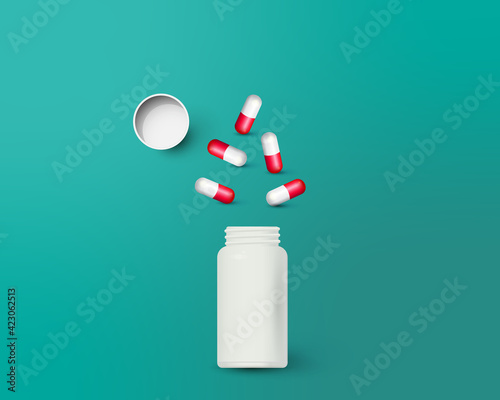 Bottle and scattered pills on color background.