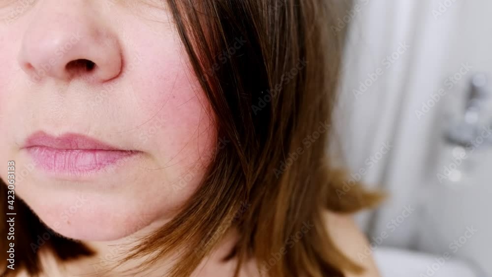 sad, serious adult middle-aged woman 50 years old looks at her hair with gray hair, skin wrinkles, worries about aging problems, concept of female age, menopause, midlife crisis sad, serious adult middle-aged woman 50 years old looks at her hair with gray hair, skin wrinkles, worries about aging problems, concept of female age, menopause, midlife crisis
