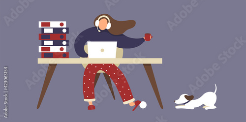Remote working. Freelance busy woman in pajama pants working from home and plays with dog. 